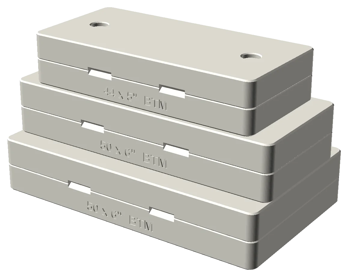 Three closed cigar molds of different sizes stacked and aligned